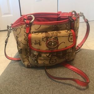 Small Coach shoulder bag with crossbody strap.